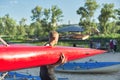 Boy teenager with sports boat kayak, water sports Royalty Free Stock Photo