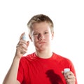 The boy, the teenager spraying fragrance perfume.Portrait on a white background