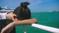 Boy teenager suffers from motion sickness while on a boat trip. Fear of traveling or illness of the during a