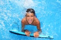 Boy teenager surfboard splashing blue water Royalty Free Stock Photo