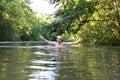 Boy teenager swims in river in summer Royalty Free Stock Photo