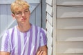 Boy teenager teen blonde male young man wearing striped t-shirt Royalty Free Stock Photo