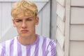 Boy teenager teen blonde male young man wearing striped t-shirt Royalty Free Stock Photo