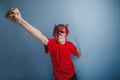 Boy teenager twelve years in red shirt in mask Royalty Free Stock Photo