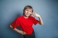 Boy, teenager, twelve years in the red shirt, nose Royalty Free Stock Photo