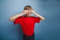 Boy, teenager, twelve years in red T-shirt, eyes Royalty Free Stock Photo