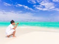 Boy with telescope on beach Royalty Free Stock Photo