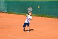 Boy in tennis lesson