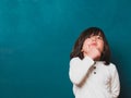 Boy thinking in front of the classroom blackboard. Royalty Free Stock Photo