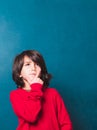 Boy thinking in front of the classroom blackboard. Royalty Free Stock Photo