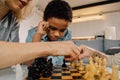 Boy thinking about right move while spending time with his family at game Royalty Free Stock Photo