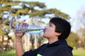 Boy thirsty eagerly drinking water Royalty Free Stock Photo