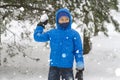 Boy throw snowball. Wintertime fun Royalty Free Stock Photo