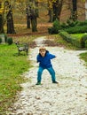 Boy throwing pebbles