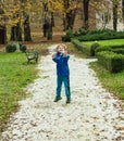 Boy throwing pebbles