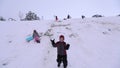 Boy throwing snowballs at camera