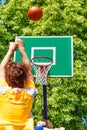 Boy throwing up the ball during basketball game Royalty Free Stock Photo