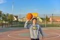 A boy throws a basketball on the playground Royalty Free Stock Photo