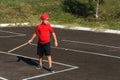 Boy throws wooden bat Royalty Free Stock Photo