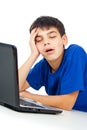 Boy tired of studying at a laptop