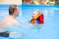 Boy to swim in pool with father Royalty Free Stock Photo