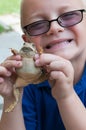 Boy and Toad Royalty Free Stock Photo