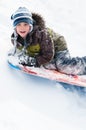 Boy tobogganing Royalty Free Stock Photo