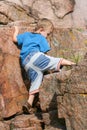 Boy Toddler Climbing a Rock Royalty Free Stock Photo