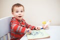 Boy toddler drawing with color pencils markers on paper in album Royalty Free Stock Photo