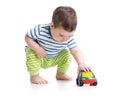 Boy toddler playing with toy car Royalty Free Stock Photo