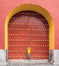 Boy tourist on the background of the large Chinese gates. Travel with children in China concept