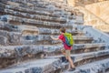 Boy tourist explores Aspendos Ancient City. Traveling with kids concept. Aspendos acropolis city ruins, cisterns Royalty Free Stock Photo