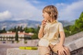 Boy tourist walking together in Montenegro. Panoramic summer landscape of the beautiful green Royal park Milocer on the Royalty Free Stock Photo