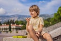 Boy tourist walking together in Montenegro. Panoramic summer landscape of the beautiful green Royal park Milocer on the Royalty Free Stock Photo