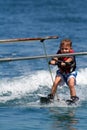 Boy towed on waterskis Royalty Free Stock Photo