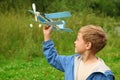 Boy with toy airplane in hands Royalty Free Stock Photo