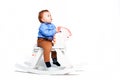 Boy on toy horse Royalty Free Stock Photo