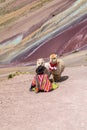 A boy in traditional Peruvian clothing and two llamas. Andes, rainbow mountains in Peru Royalty Free Stock Photo