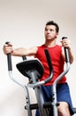 Boy on training apparatus in sportclub Royalty Free Stock Photo