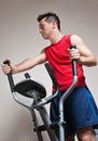 Boy on training apparatus in sportclub Royalty Free Stock Photo