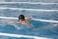 The boy trains in swimming pool, before the compet Royalty Free Stock Photo