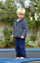 Boy on trampoline Royalty Free Stock Photo