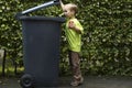 Boy Trashing A Can Royalty Free Stock Photo