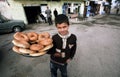 Boy with a tray of bread