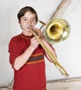 Boy with a trombone Royalty Free Stock Photo