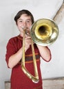 Boy with a trombone Royalty Free Stock Photo