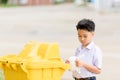 Boy trow the garbage Royalty Free Stock Photo