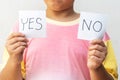 Boy trying to make a decision between Yes or No choice Royalty Free Stock Photo