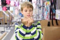 Boy two hands holds metal dumbbell