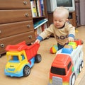 Boy with two trucks Royalty Free Stock Photo